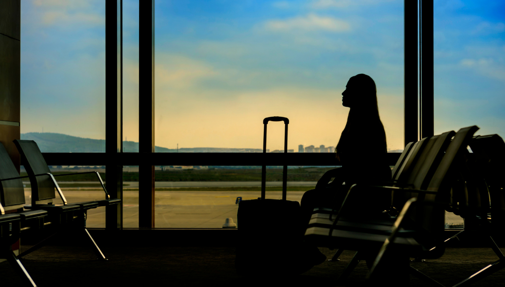 woman waiting at empty airport