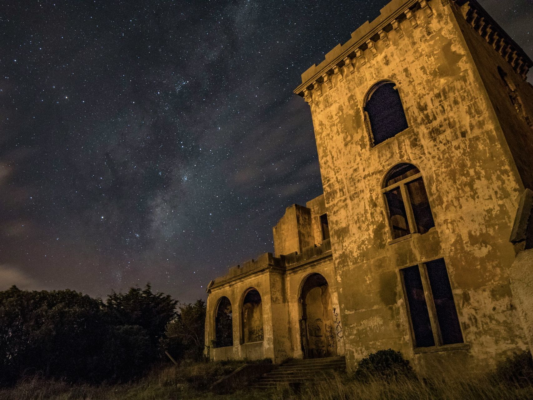 Travellers exploring a landmark at night