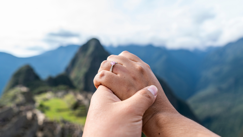engagement ring in front of mountain range
