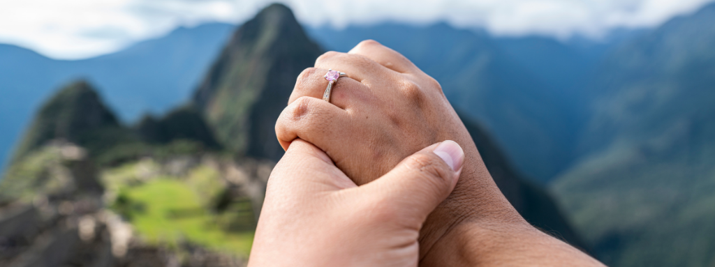 engagement ring in front of mountain range
